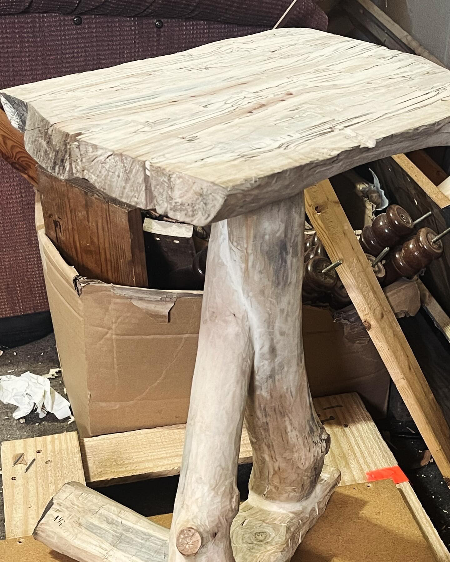 A sculptural pale driftwood table
